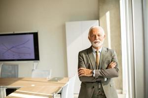 Senior business man in the boardroom at the office photo