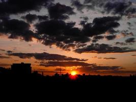 Autumn red sunset with a purple sky photo