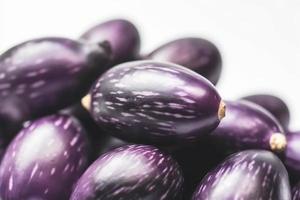 Close up of Eggplants on white background with copy space. Healthy vegan vegetarian food concept photo