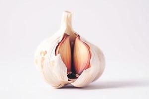 Close up of Garlic on white background with copy space. Healthy vegan vegetarian food concept photo