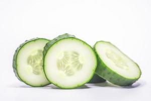 Close up of Cucumbers on white background with copy space. Healthy vegan vegetarian food concept photo