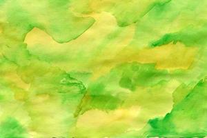 Watercolor green background with brush strokes, dots, spots photo