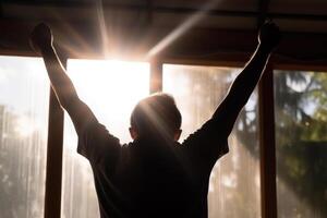 success victory concept silhouette man raised his hands up sunlight photo