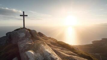 God sun light of faith cross in rock on the edge of a cliff by the ocean photo