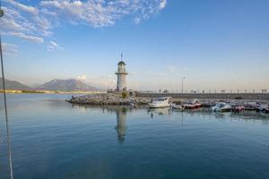 A wonderful lighthouse at sunset on the Mediterranean coast photo