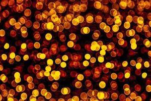 abstract bokeh background of golden light burst made from bokeh motion. photo