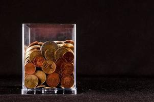 A glass with coins photo