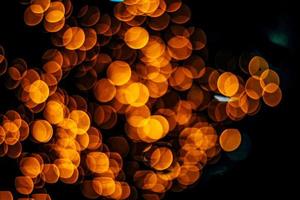 abstract bokeh background of golden light burst made from bokeh motion. photo