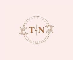 initial TN letters Beautiful floral feminine editable premade monoline logo suitable for spa salon skin hair beauty boutique and cosmetic company. vector