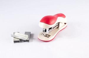 Stapler on light background photo