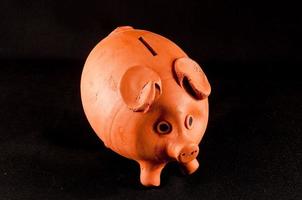 Piggy bank on dark background photo