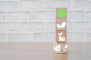 ESG concept of environmental, Wooden cube block with ESG icon with copy space, social and corporate governance concept. photo