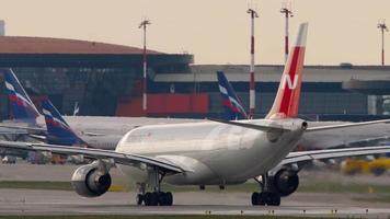 MOSCOW, RUSSIAN FEDERATION JULY 30, 2021 - Nordwind passenger plane takeoff at Sheremetyevo airport, side view. Tourism and travel concept video