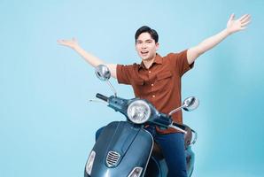 Image of yougn Asian man on motorbike photo