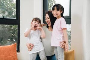 Image of young Asian mother and daughter at home photo