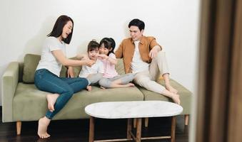 Young Asian family at home photo