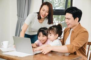 Young Asian family at home photo