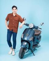 Image of yougn Asian man on motorbike photo