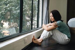 Young Asian woman at home photo