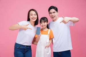 Young Asian family on background photo