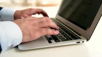 Person use laptop, typing keyboard, look for a result, selective focus, noise effect video