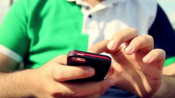 Man using his smartphone video