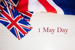 First of May Day. British holidays concept. Holiday in United Kingdom. Great Britain flag background. photo