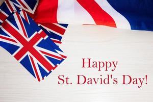 Happy St. David's Day. British holidays concept. Holiday in United Kingdom. Great Britain flag background. photo