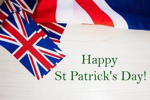 Happy St. Patrick's Day. British holidays concept. Holiday in United Kingdom. Great Britain flag background. photo