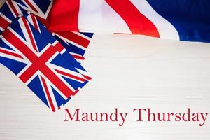 Maundy Thursday. British holidays concept. Holiday in United Kingdom. Great Britain flag background. photo