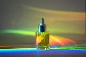 Face oil in front of rainbow photo