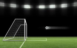 The soccer ball is flying into the goal on the soccer field. ball game concept photo