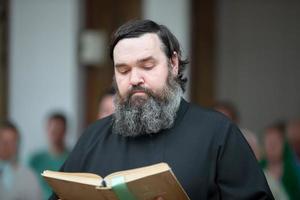 .Priest reads bible. photo