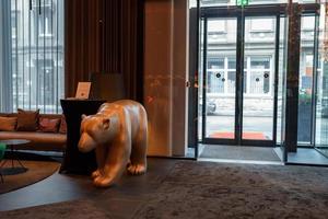Sculpture of a bear at the entrance to the luxury hotel. photo