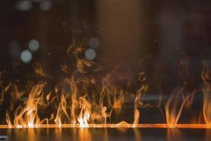 Flames of electric fireplace in luxury hotel photo