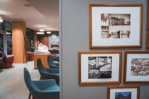 Picture frames mounted on wall in room of luxury hotel photo