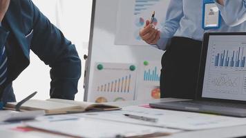 Financial analysts analyze business financial reports on a digital tablet planning investment project during a discussion at a meeting of corporate showing the results of their successful teamwork. video