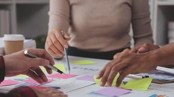 Financial analysts analyze business financial reports on a digital tablet planning investment project during a discussion at a meeting of corporate showing the results of their successful teamwork. video