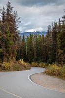 Winding road in the mountains in Western Canada on a cloudy autumn day photo