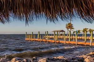 view from the tiki hut of the dock and fishing pier on a windy sunny day in Key Largo, Florida photo