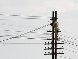 Electrician Man on pole photo