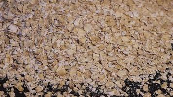 Rolled oats background. Organic diet cereal healthy food video