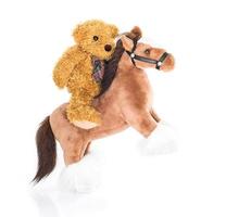 Teddy bear riding a horse photo