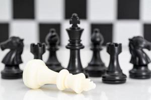 Set of Black and white chess pieces on white background photo