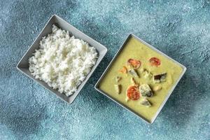 Thai green chicken curry with white rice photo