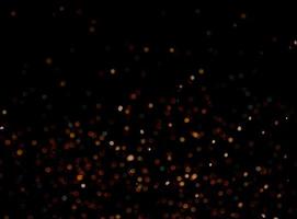 abstract bokeh background of golden light burst made from bokeh motion. photo