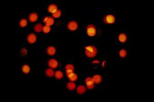 abstract bokeh background of golden light burst made from bokeh motion. photo