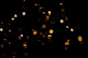 abstract bokeh background of golden light burst made from bokeh motion. photo