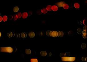abstract bokeh background of golden light burst made from bokeh motion. photo