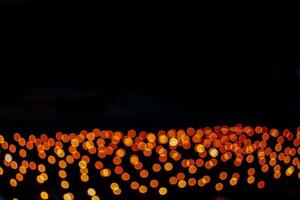 abstract bokeh background of golden light burst made from bokeh motion. photo